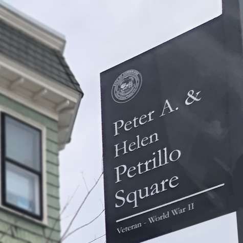 This memorial plaque stands outside the home where the Petrillos used to live. It designates the area as the "Peter A. & Helen Petrillo Square."