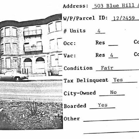 A scan of a property at 503 Blue Hill Avenue in Roxbury shows a property with four residential units reported. The three-story building has been boarded up. Information to the side of the photograph reveals the auditor found the building to be in fair condition, tax-delinquent and not city-owned.]